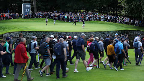 Fans watch the action on the 13th green