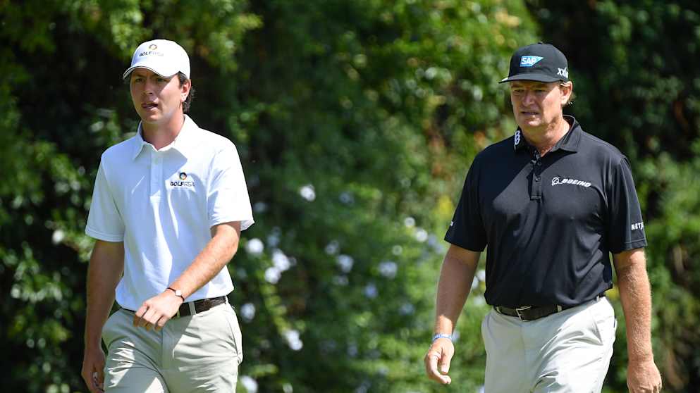 Ernie Els of South Africa walks with his nephew Joyan Rebula