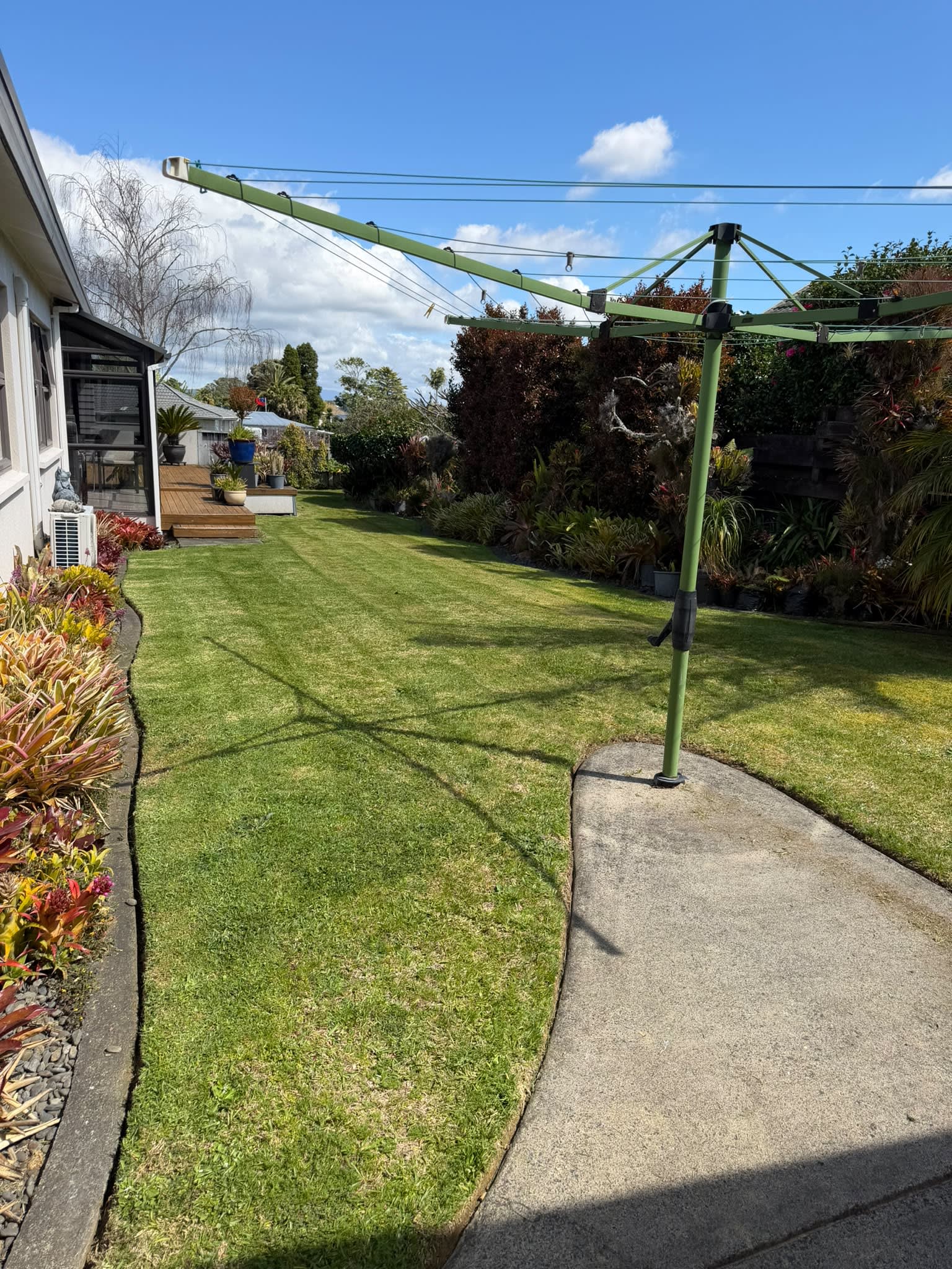Lawn mowing Tauranga — beautifully maintained lawn and garden by local gardener