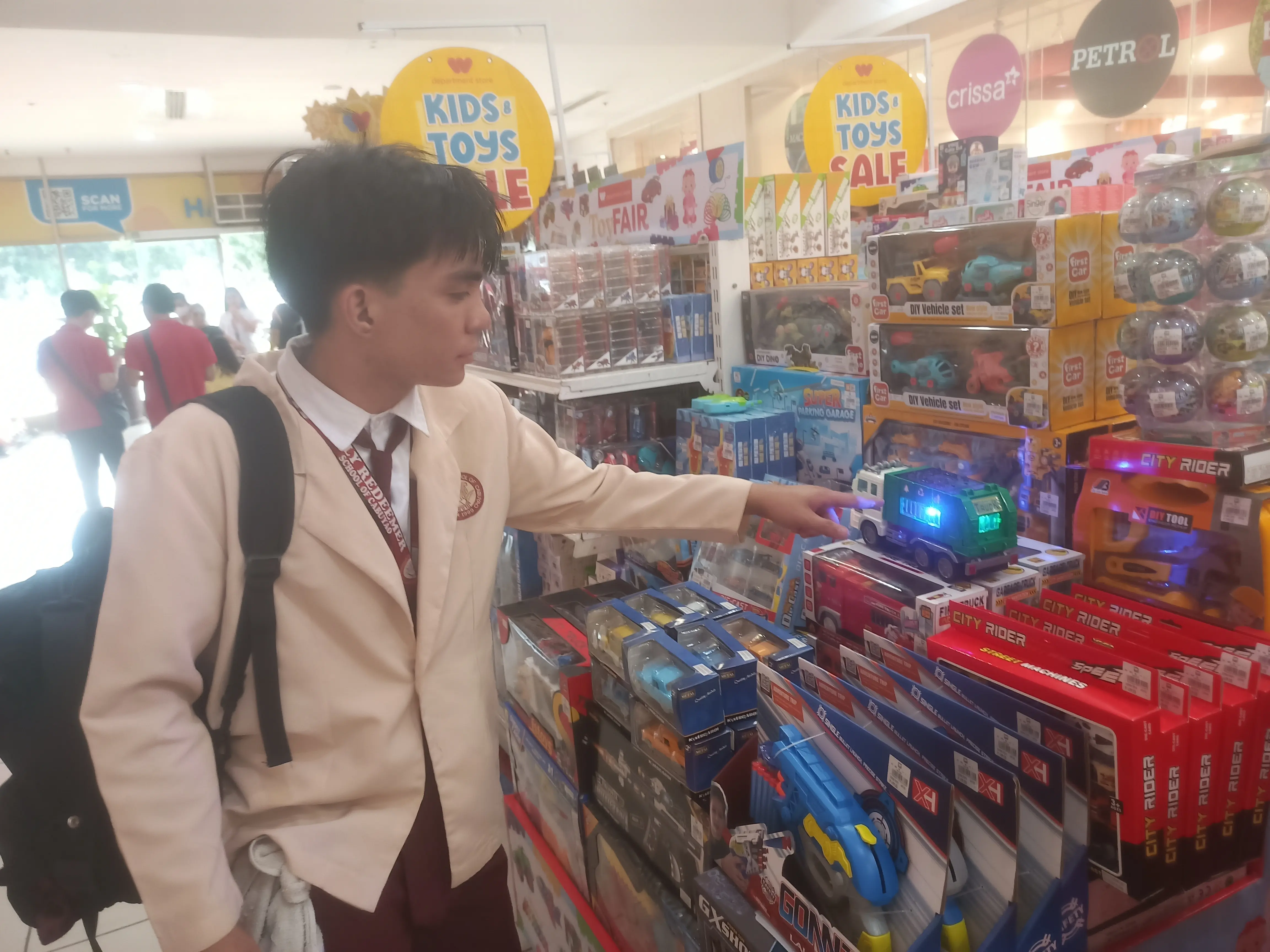 Radhni looking at kid's toys