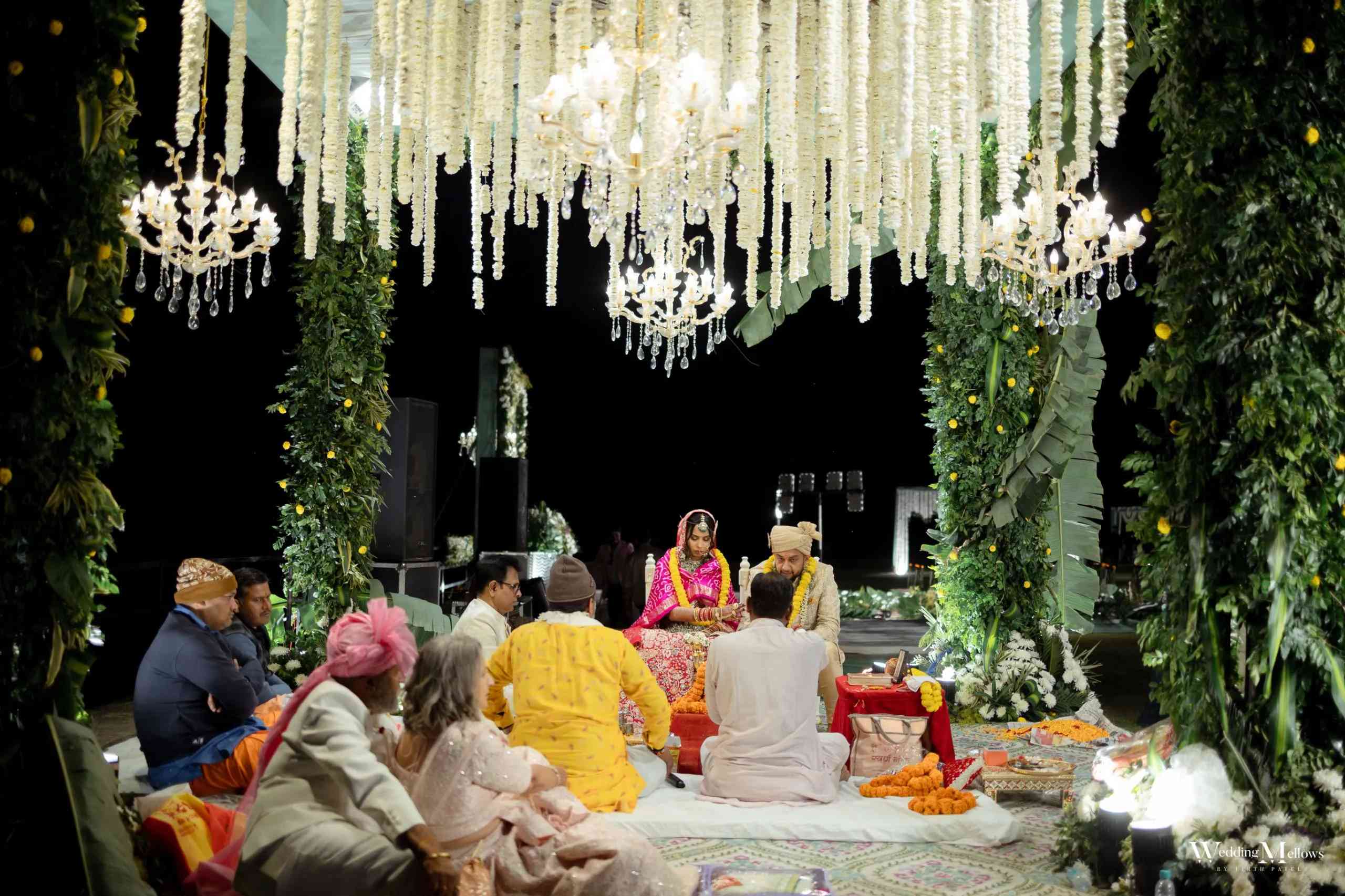 Grand wedding reception hall with lavish decorations and lighting
