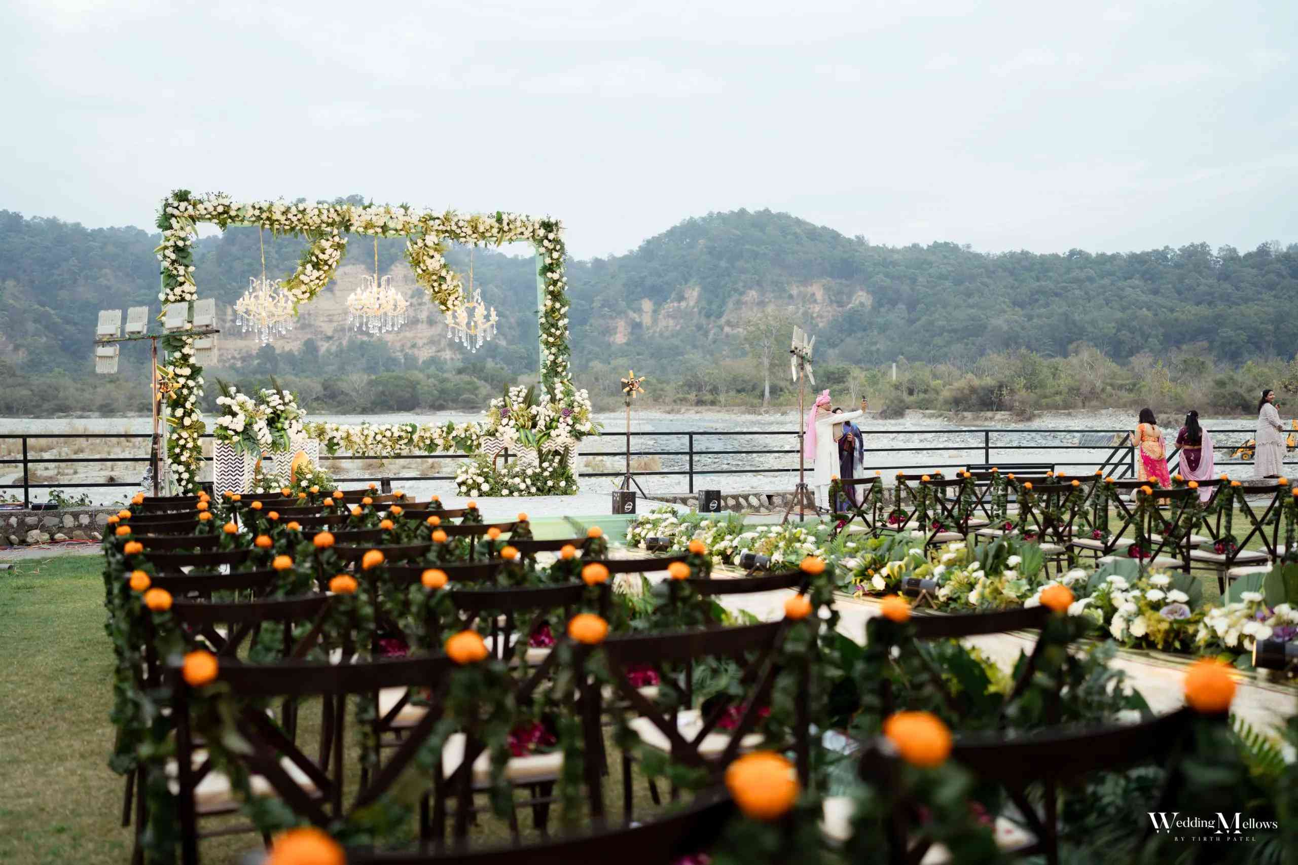Elegant outdoor wedding ceremony with mountain backdrop