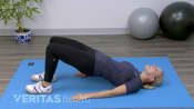 Woman performing a bridge exercise.