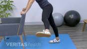 Woman doing a hip swing.