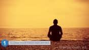 Man releasing his endorphins while sitting on the beach meditating.