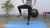 Woman doing a gate stretch
