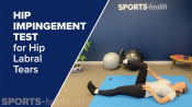 Physical therapist performing a hip impingement test.