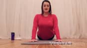 Woman pressing up on the floor from a prone position to stretch her SI Joint