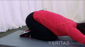 Woman performing a four point back flexion.