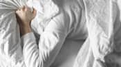 Person covering their head with their pillow