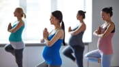 Pregnant women in a yoga class.