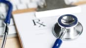 Prescription tab with a keyboard and stethoscope.