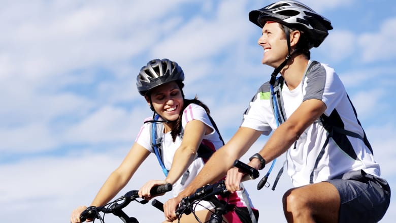 Couple biking outdoors