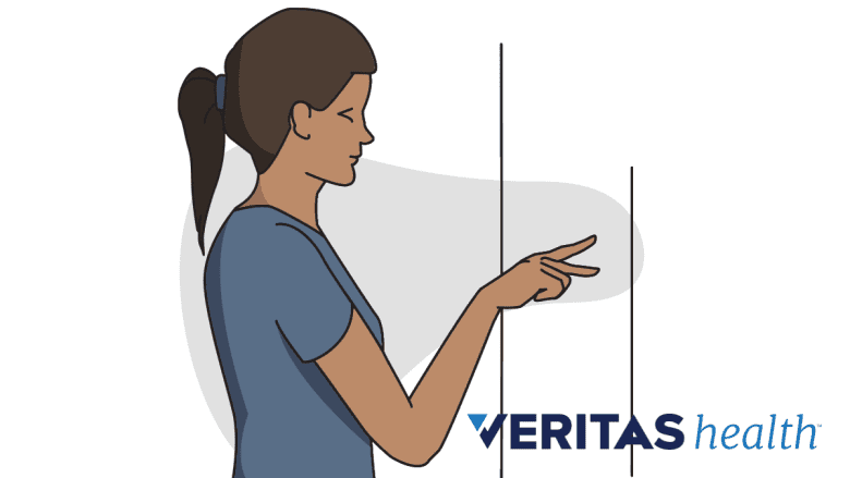 Performing the finger walk exercise for frozen shoulder