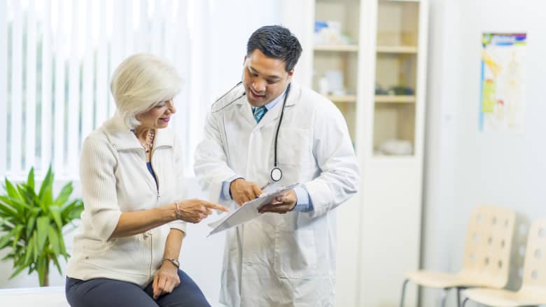 Doctor and patient consultation in an office.