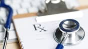 Prescription tab with a keyboard and stethoscope.