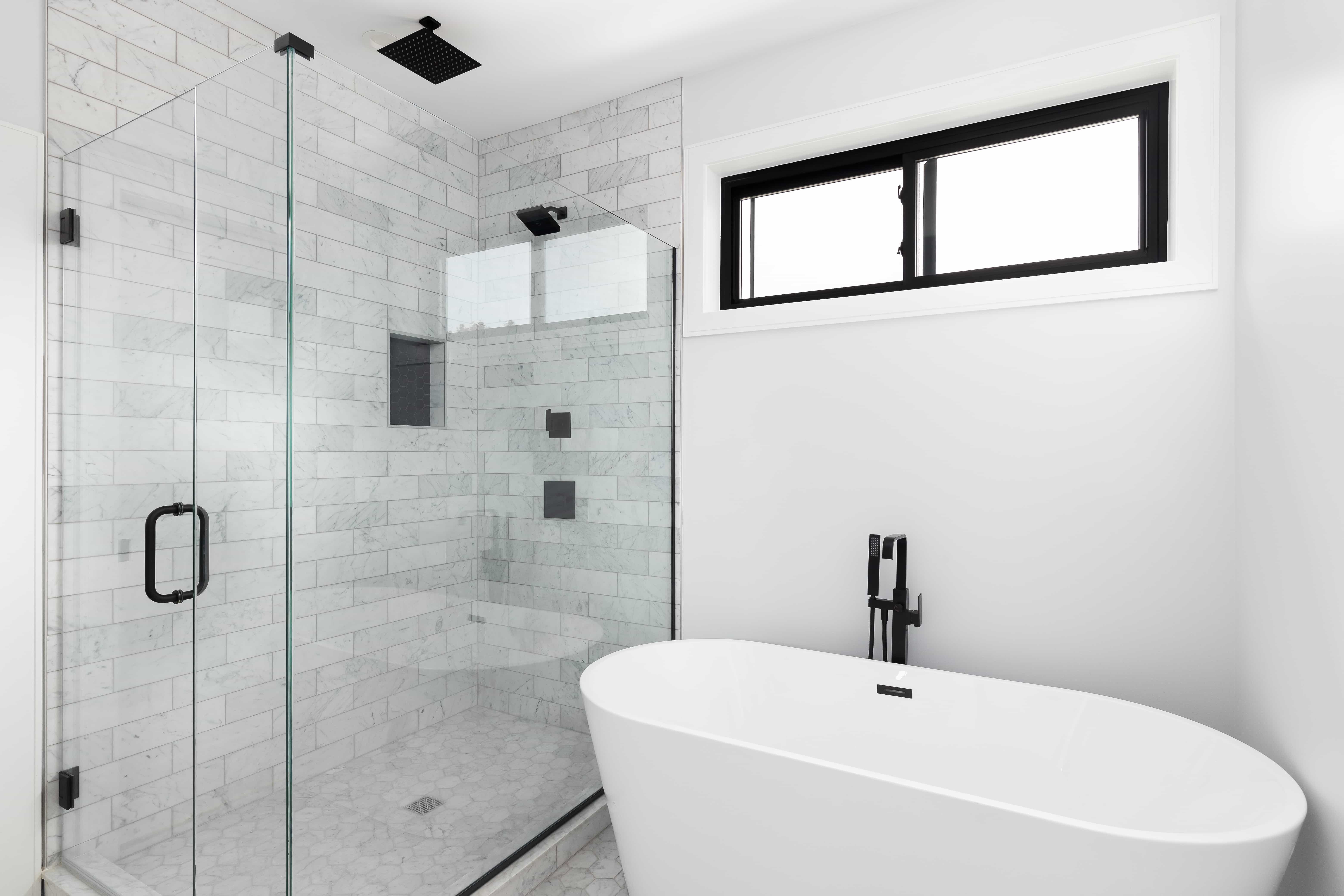 Custom frameless shower door installation in a Tampa bathroom by Henderson's Glass & Mirror