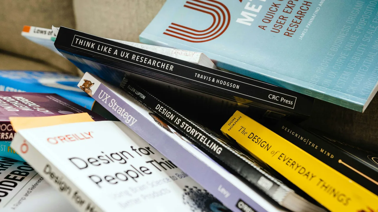 A stack of UX books
