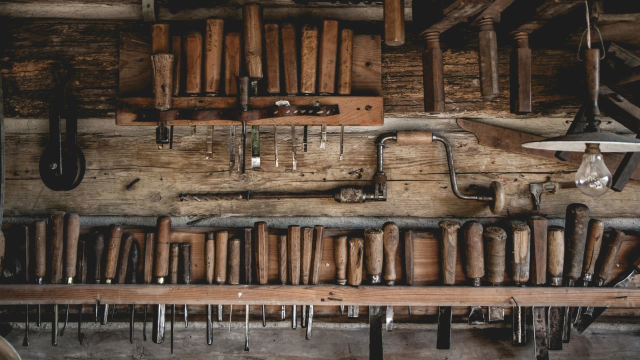 Woodworking tools hanging on a wall