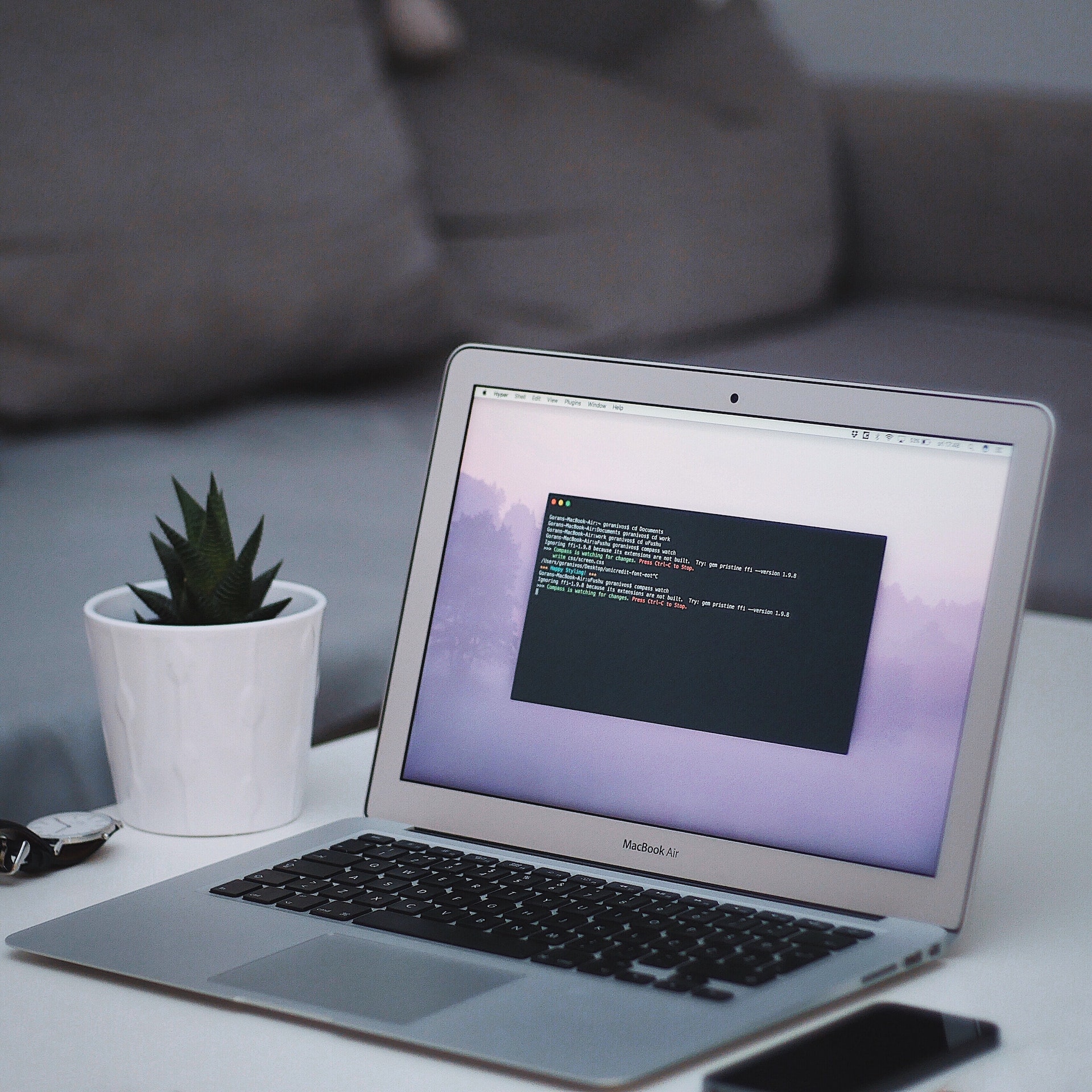 A photo of a MacBook Air screen running the terminal