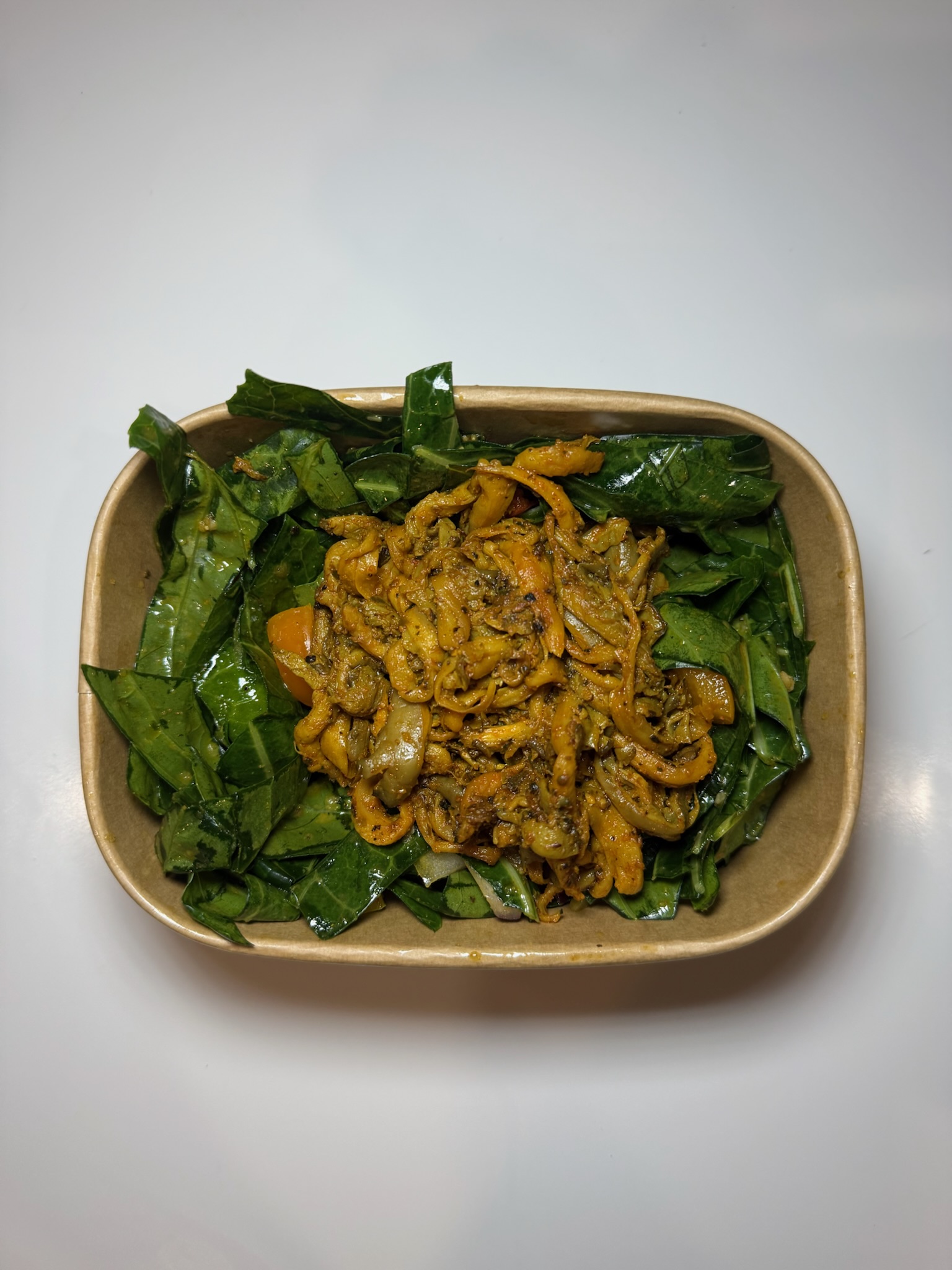 Pulled Oyster Mushrooms over Marinated Collard Greens