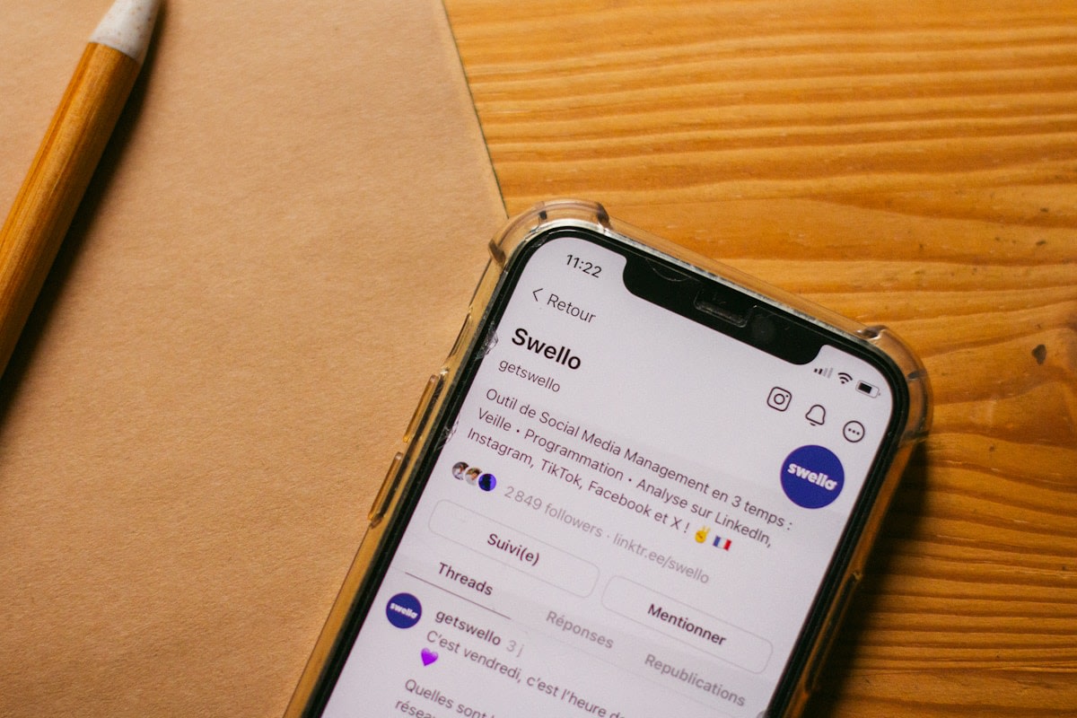 Social media messages on a mobile phone screen in a business context