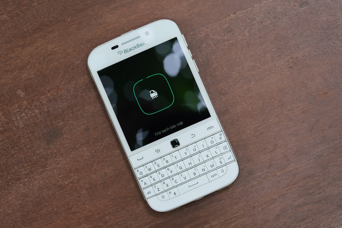 Mobile phone showing WhatsApp messaging in a business context