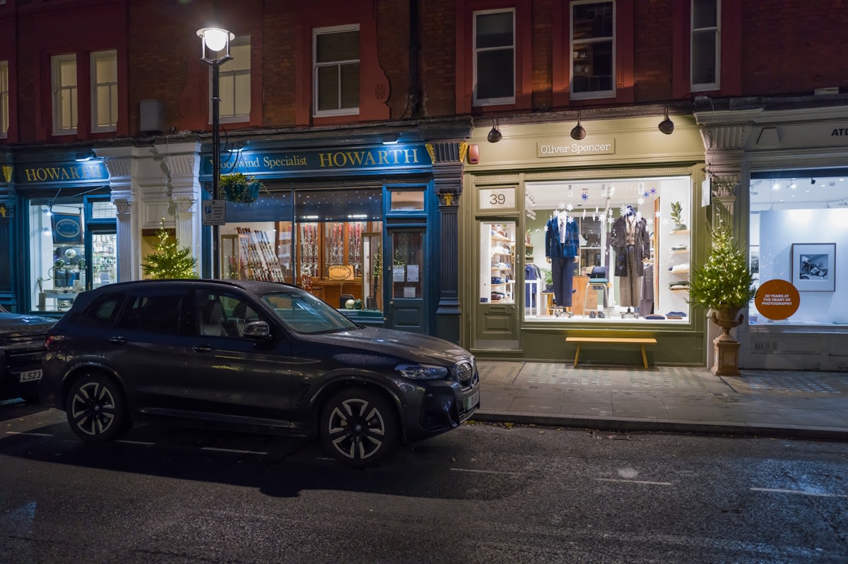 Service business owner reviewing evening enquiries on mobile device after hours