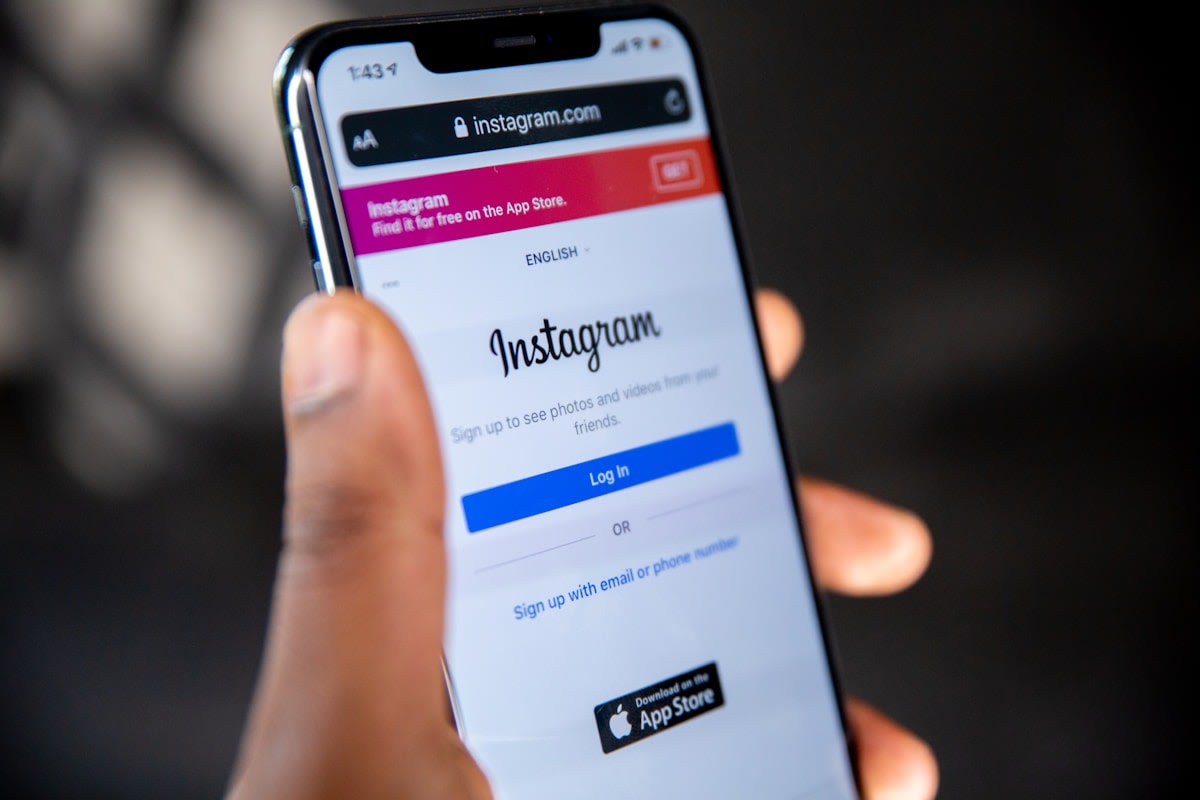 Service business owner responding to Instagram direct messages from potential customers on mobile phone