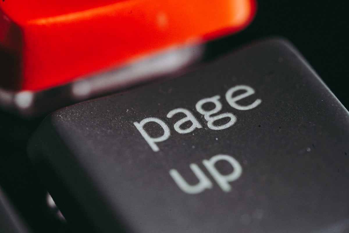 Business owner checking social media messages on a phone while unanswered enquiries pile up
