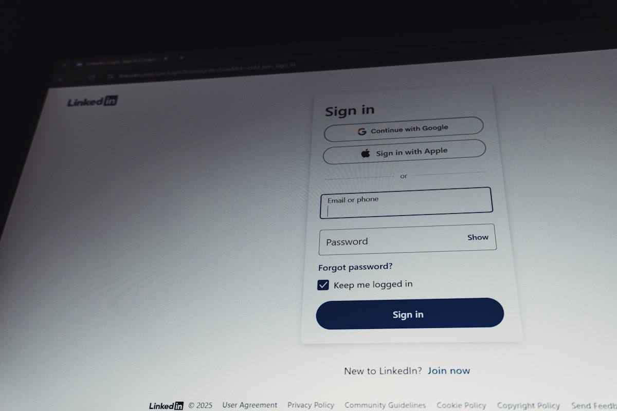 A person pausing at a laptop screen before completing an online booking form