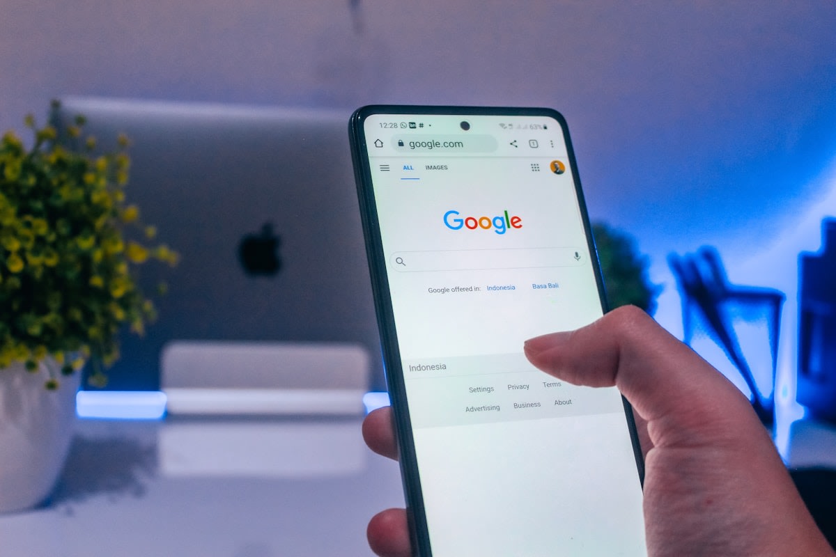Service business owner frustrated at a laptop showing Google Ads dashboard with low conversion data