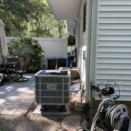 Central air conditioning condenser installed by Central Air Systems on Long Island