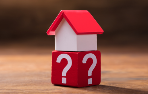 RentRedi FAQ image: picture of a toy house on a red block with white question marks on it