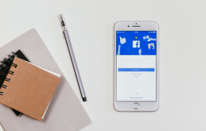 market rentals on facebook image: phone with facebook app open