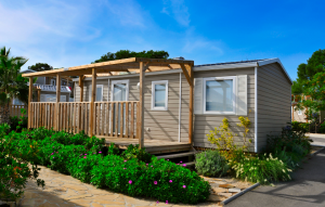 image of a mobile homes with a wooden front porch