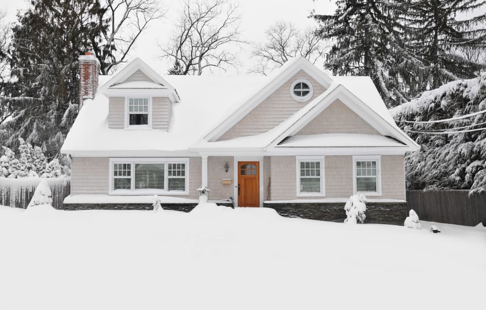 Landlord Inspection Checklist image of a snow-covered single-family house