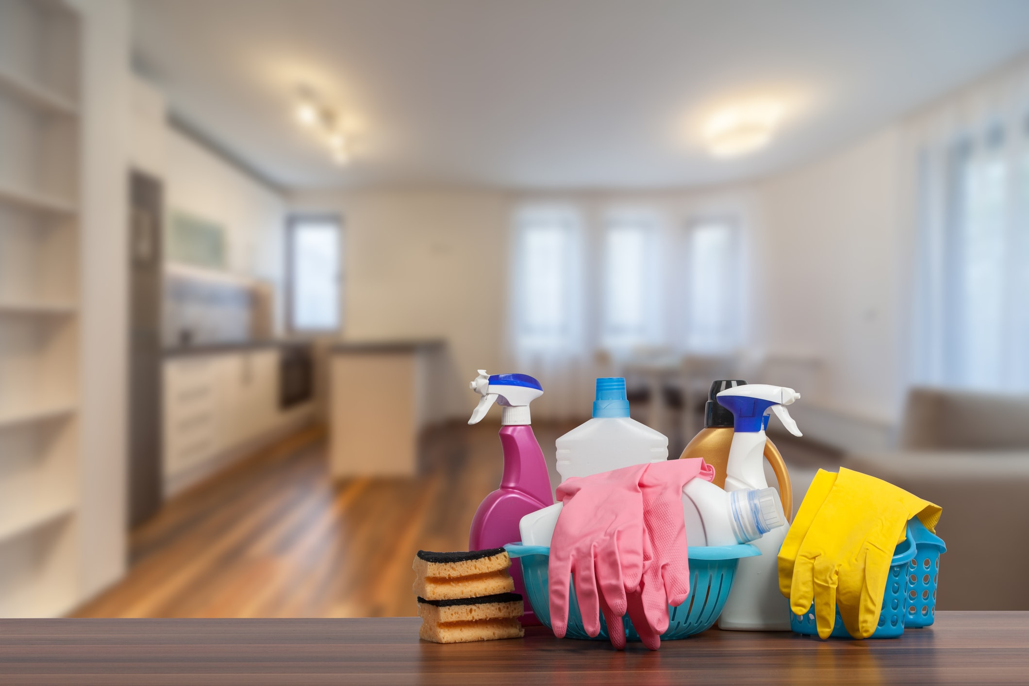 spring cleaning your rentals image of cleaning supplies and rubber gloves