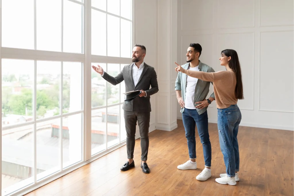 pre-qualify rental applicants real estate agent showing bright apartment to young couple during rental property tour