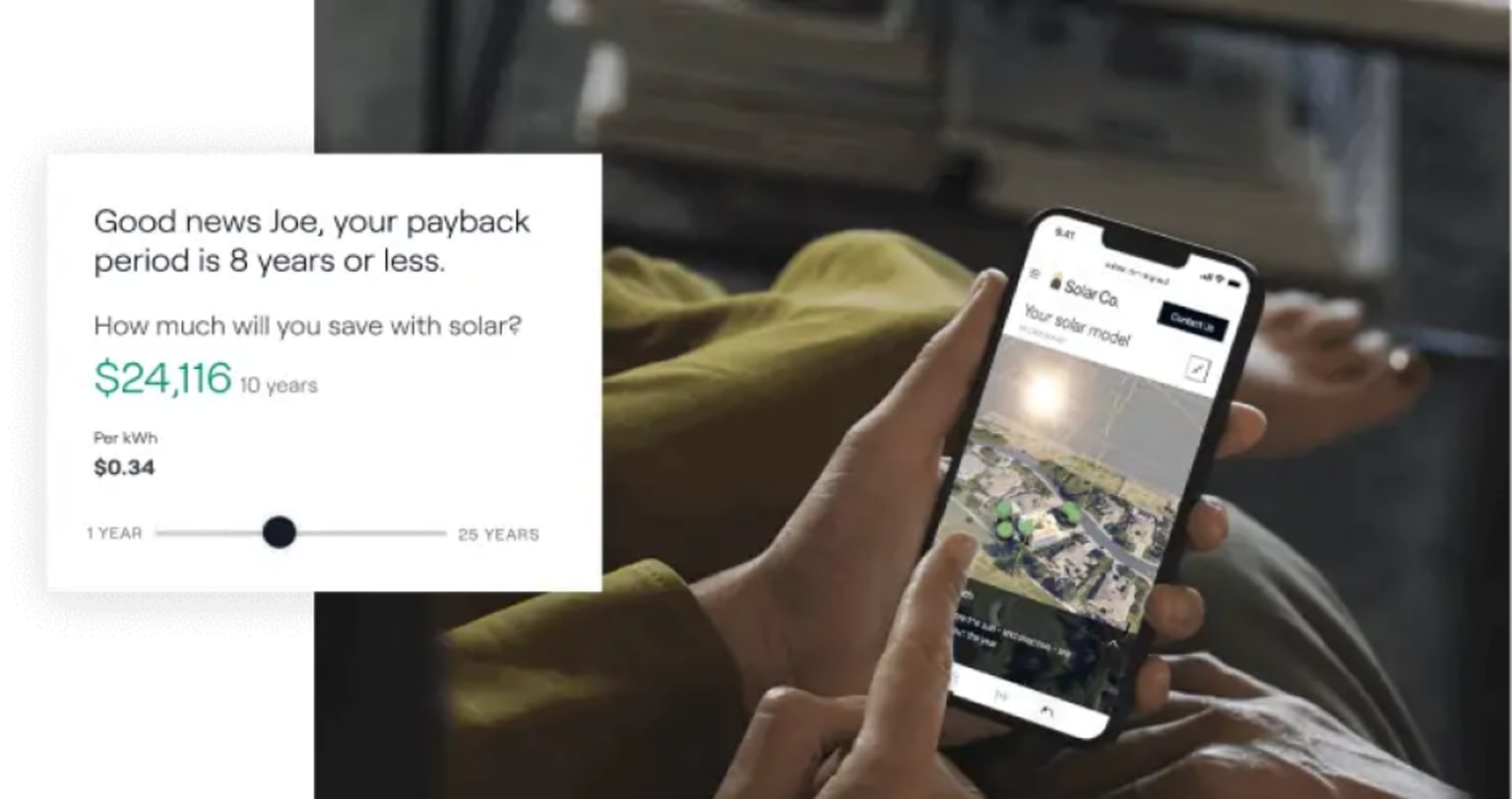 A person reading an energy savings estimate on a smartphone
