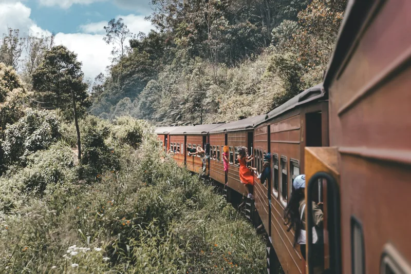 Train through the green hills between Nanu Oya and Ella in Sri Lanka