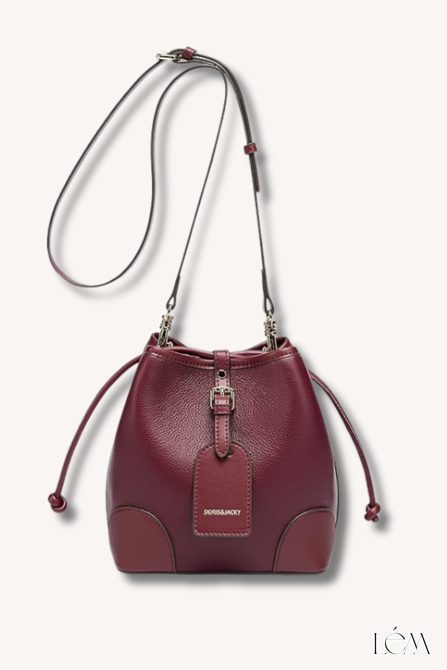 Close-up of burgundy bucket bag with gold chain detail