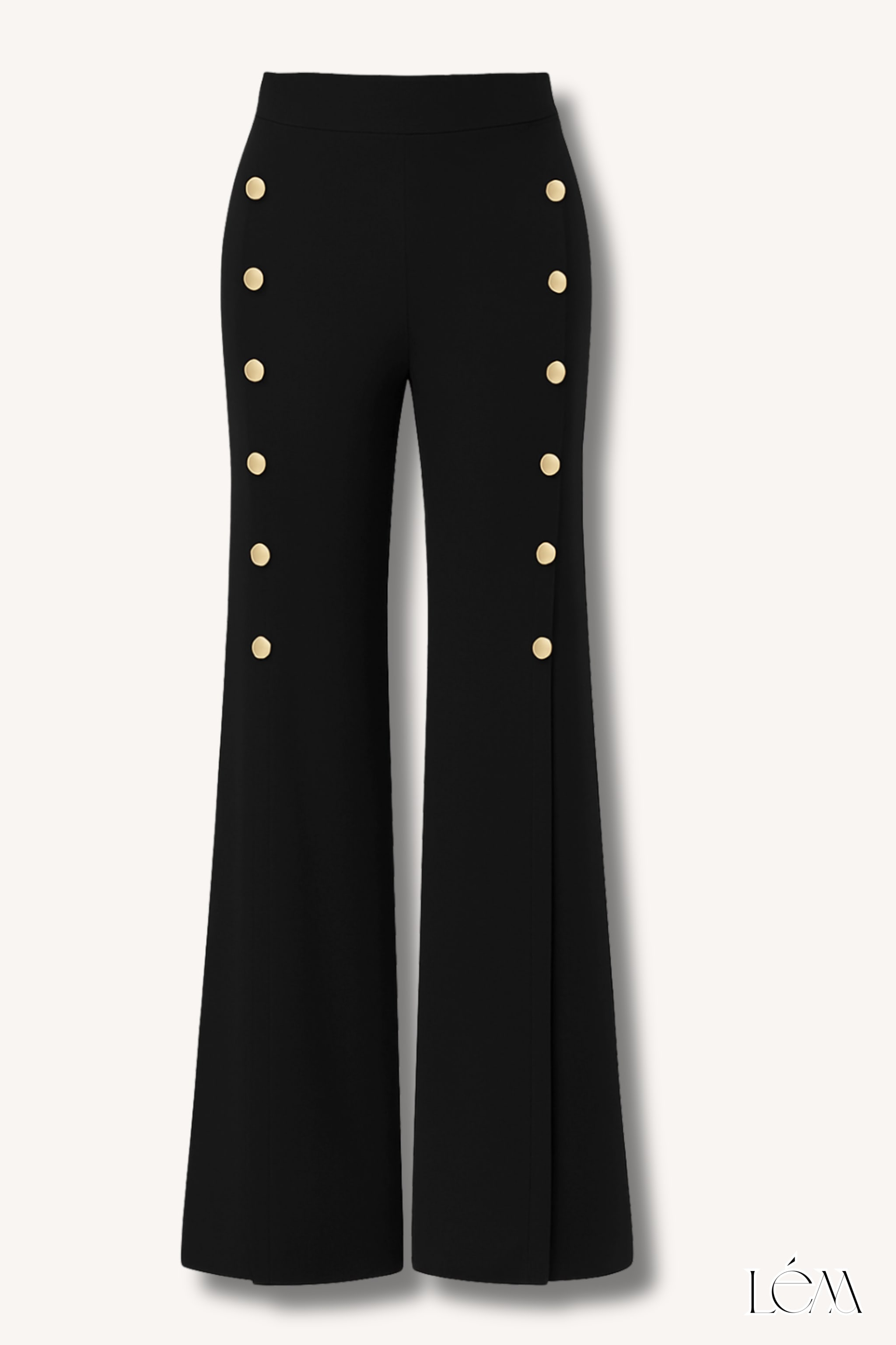 Close-up of cow print coat texture and gold button details on sailor pants Right