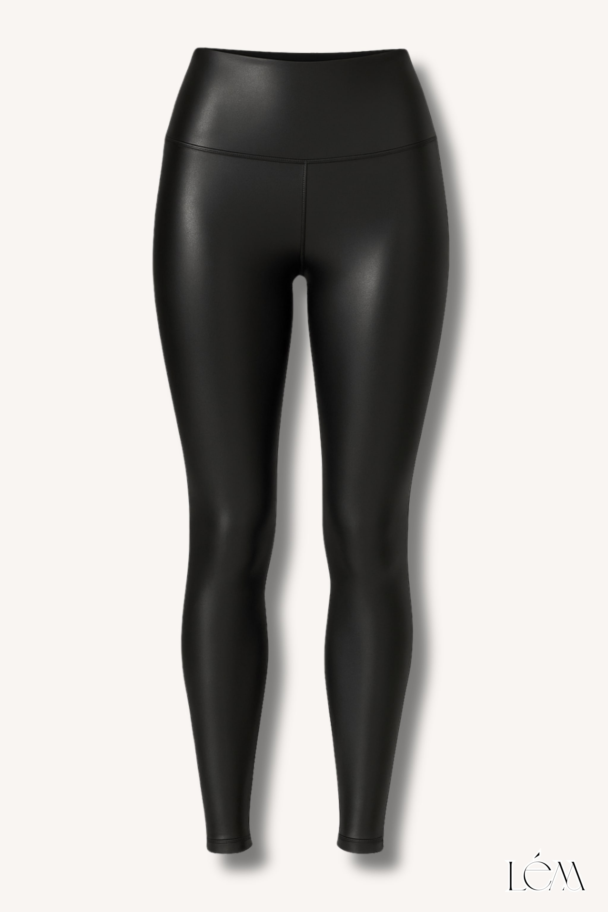 Close-up of one-shoulder silk top with bow detail and high-shine faux leather leggings texture Right