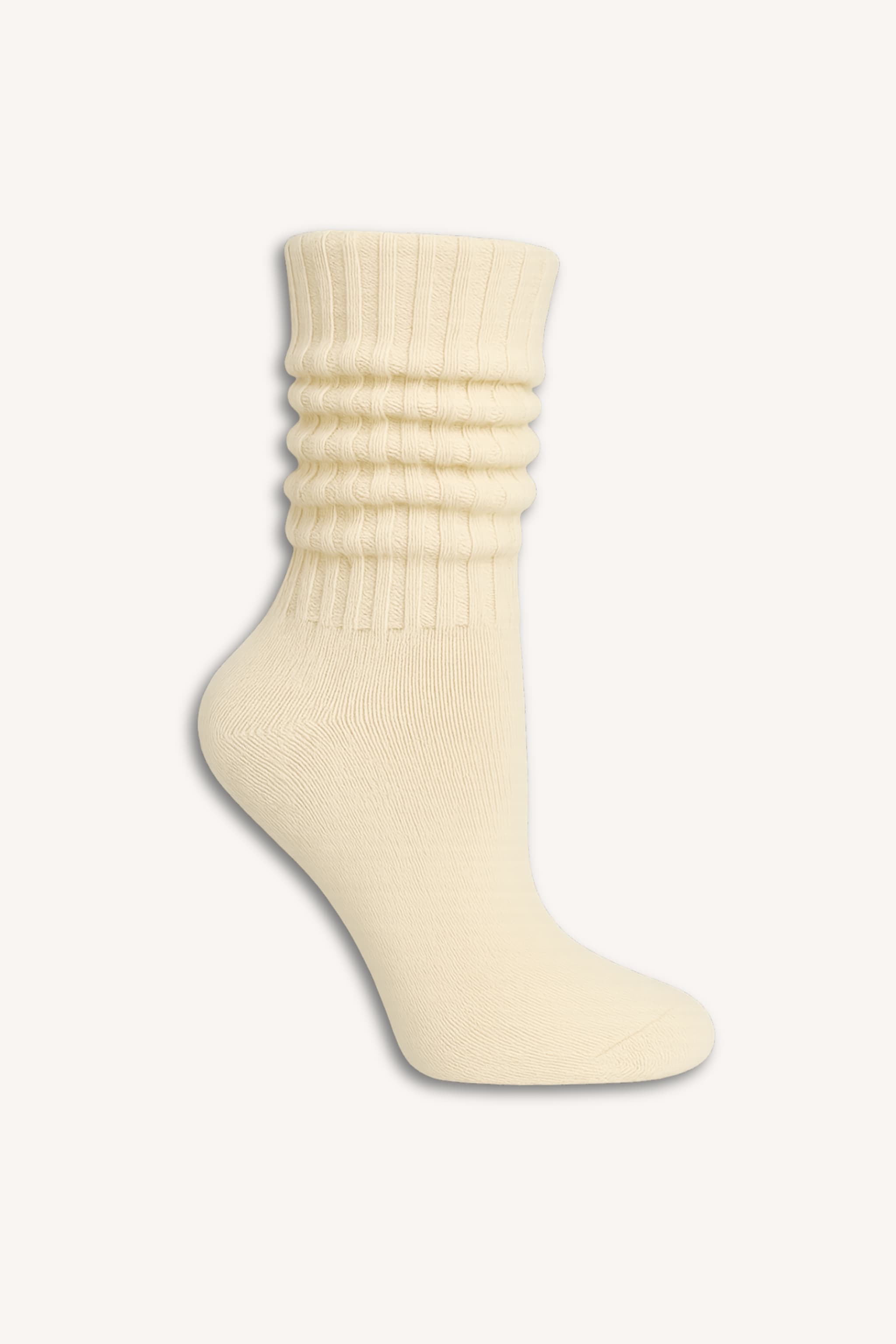 Close up of ribbed fabric texture next to detail of shearling clog and socks. Right