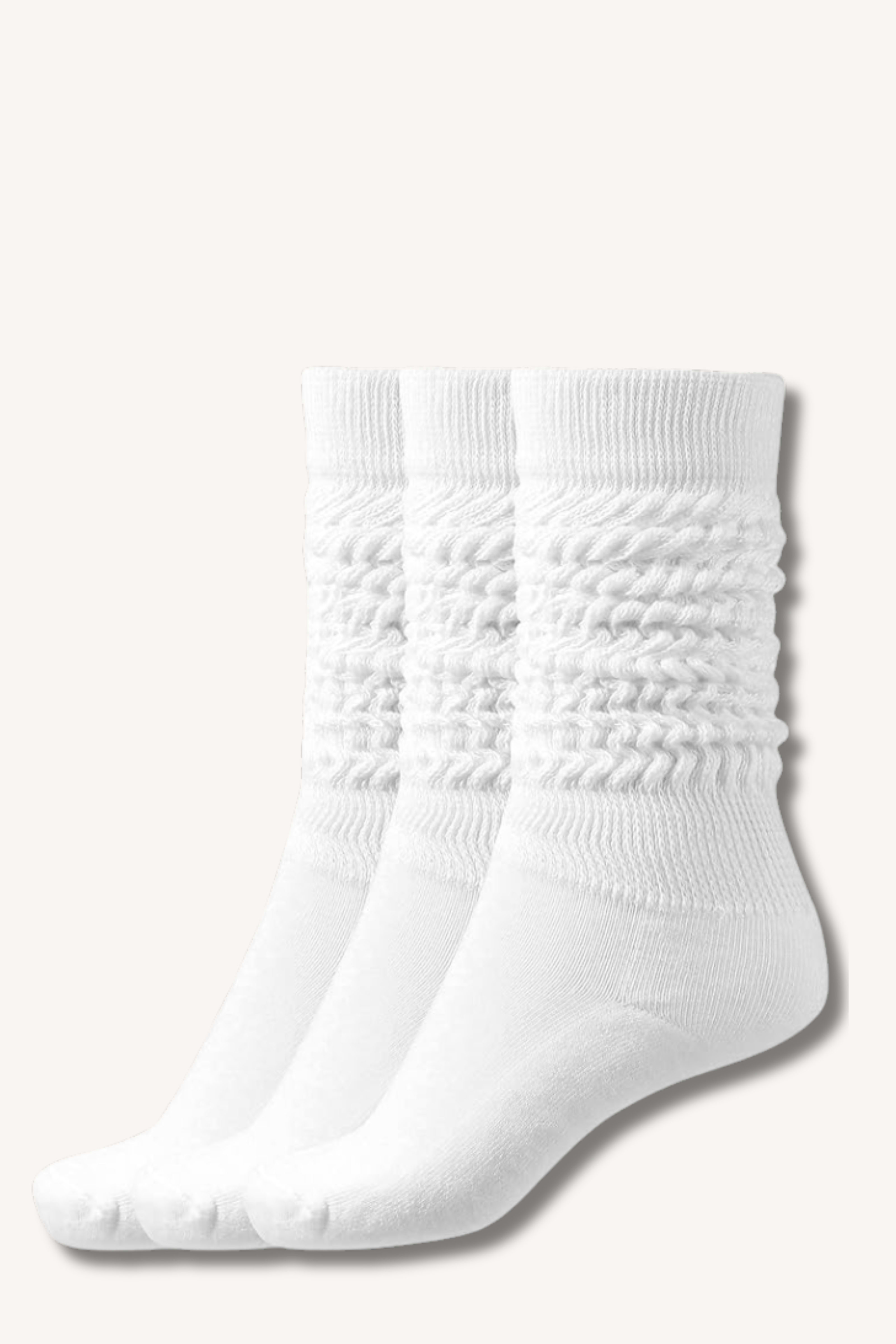 Close-up of slouchy cream socks with natural scrunch over sneakers