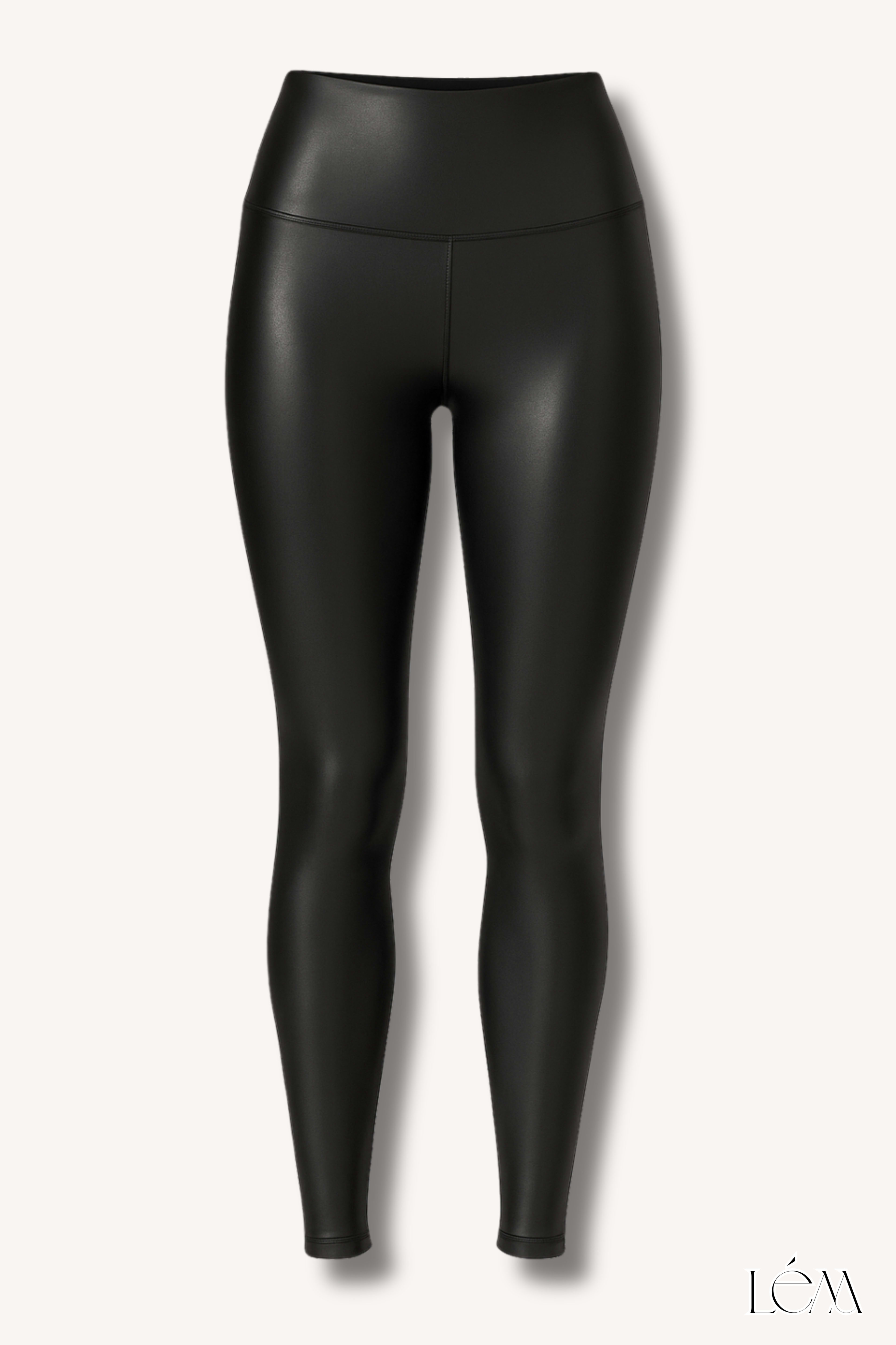 Close-up of one-shoulder silk top with bow detail and high-shine faux leather leggings texture Right