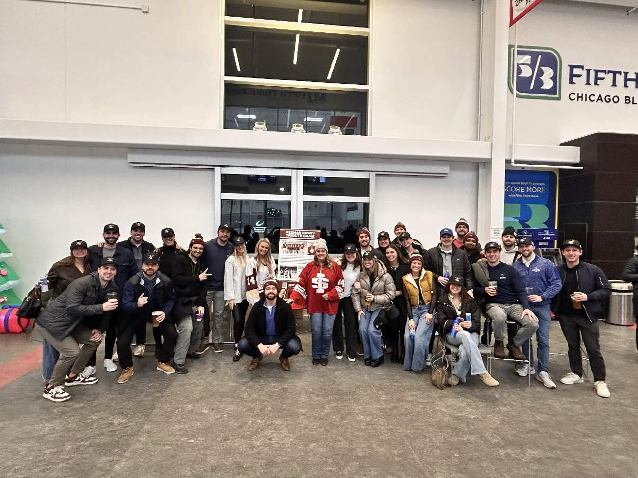 Large group of friends and family gathered inside the arena for the tribute game