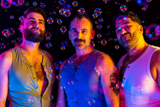 Three men laughing with bubbles