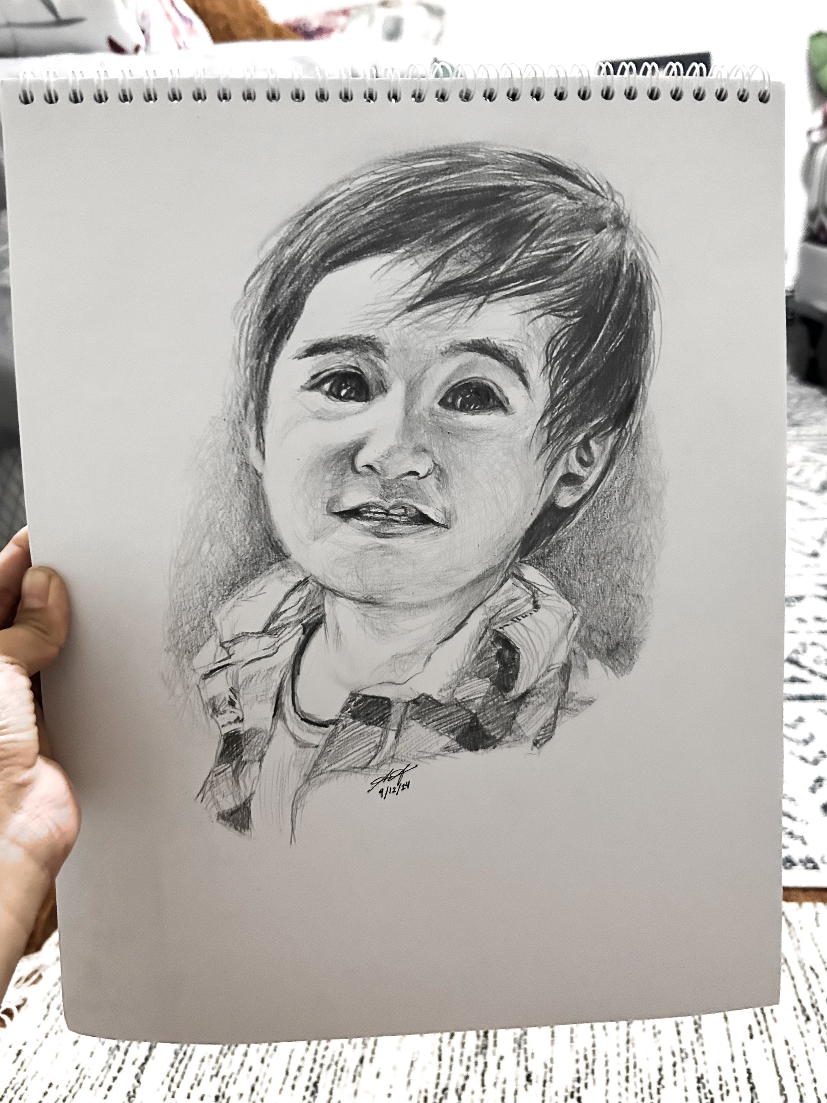 Reference-inspired pencil sketch of a baby portrait.